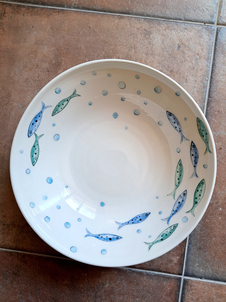 Deep ceramic plate with fish